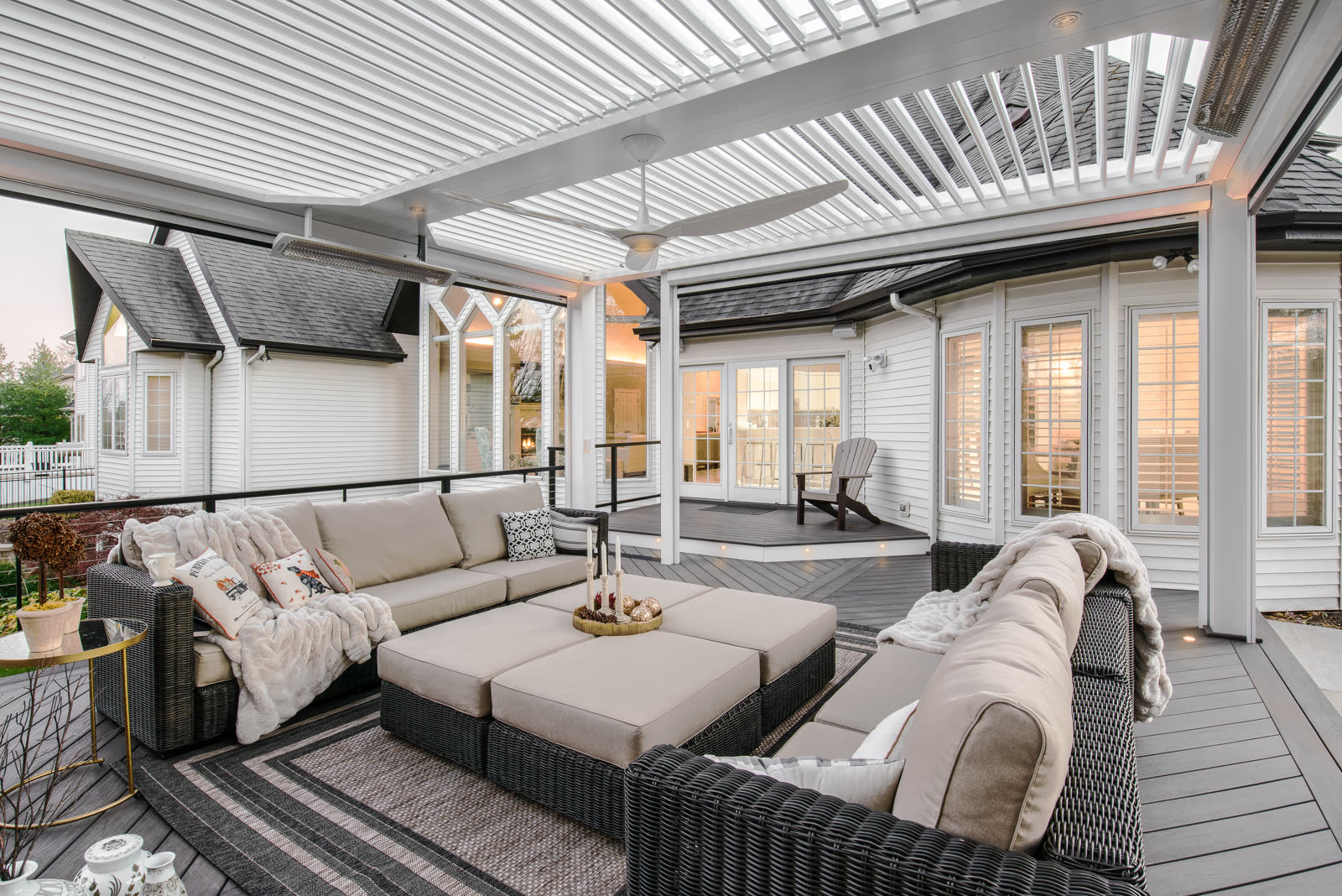 Open louvers above a cozy outdoor living room