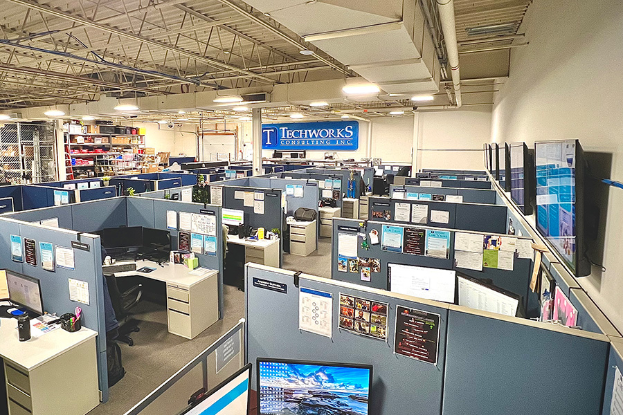 Techworks office workspace with cubicles and team workstations