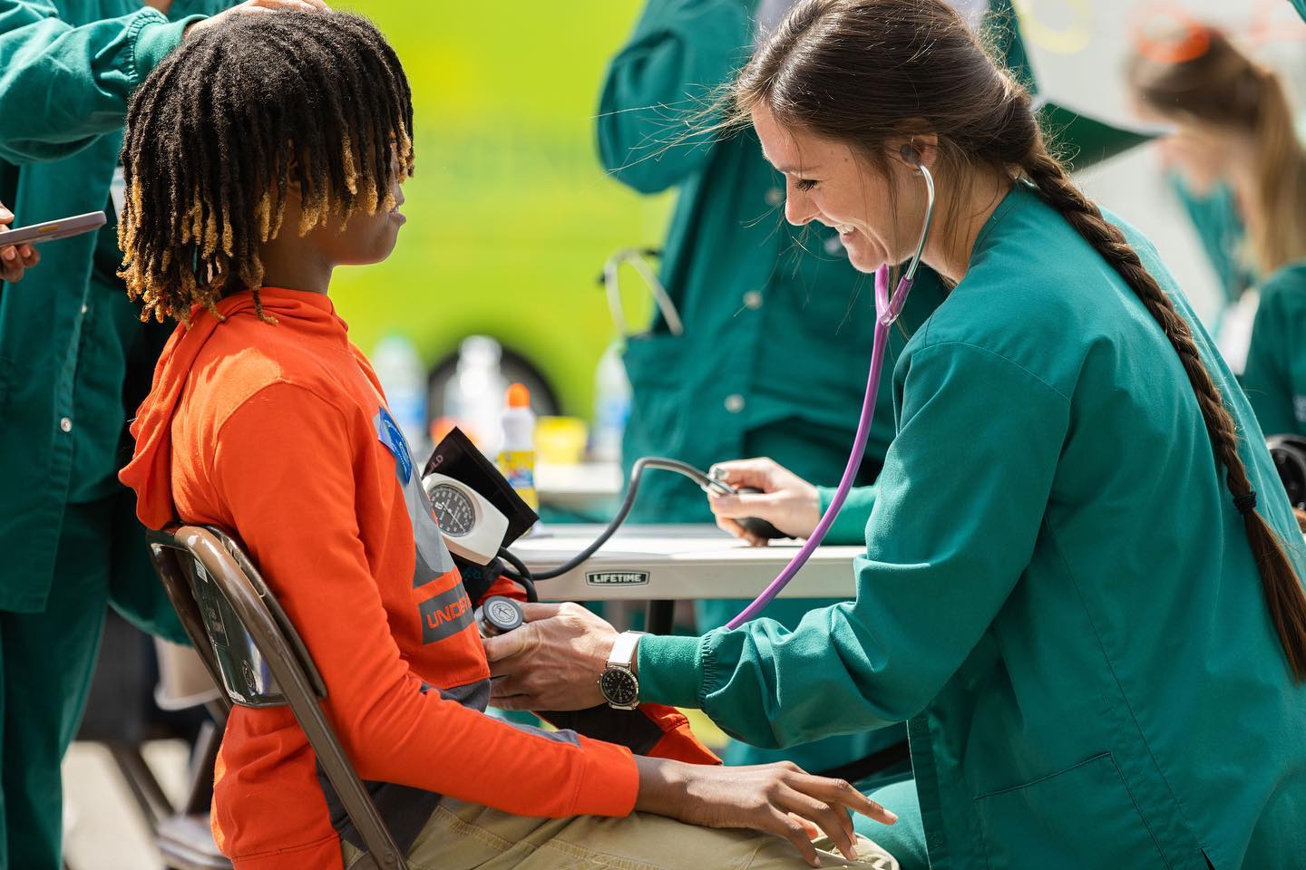 Healthcare professional with a child in the community
