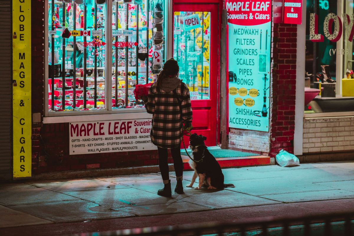 A resident with a dog outside a downtown
