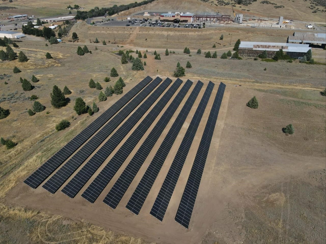 Ground-mount solar rows powering the Karuk Tribe's Rain Rock Casino in Yreka, California