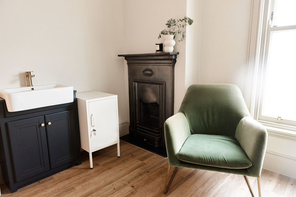 Consultation room with sage green chair