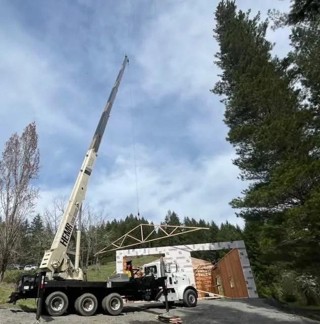 Setting roof trusses with our truck crane