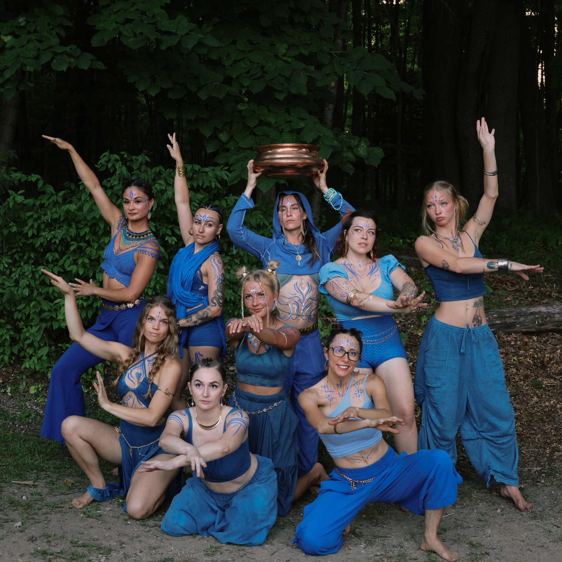 Symbiotica Movement Collective in blue performance attire