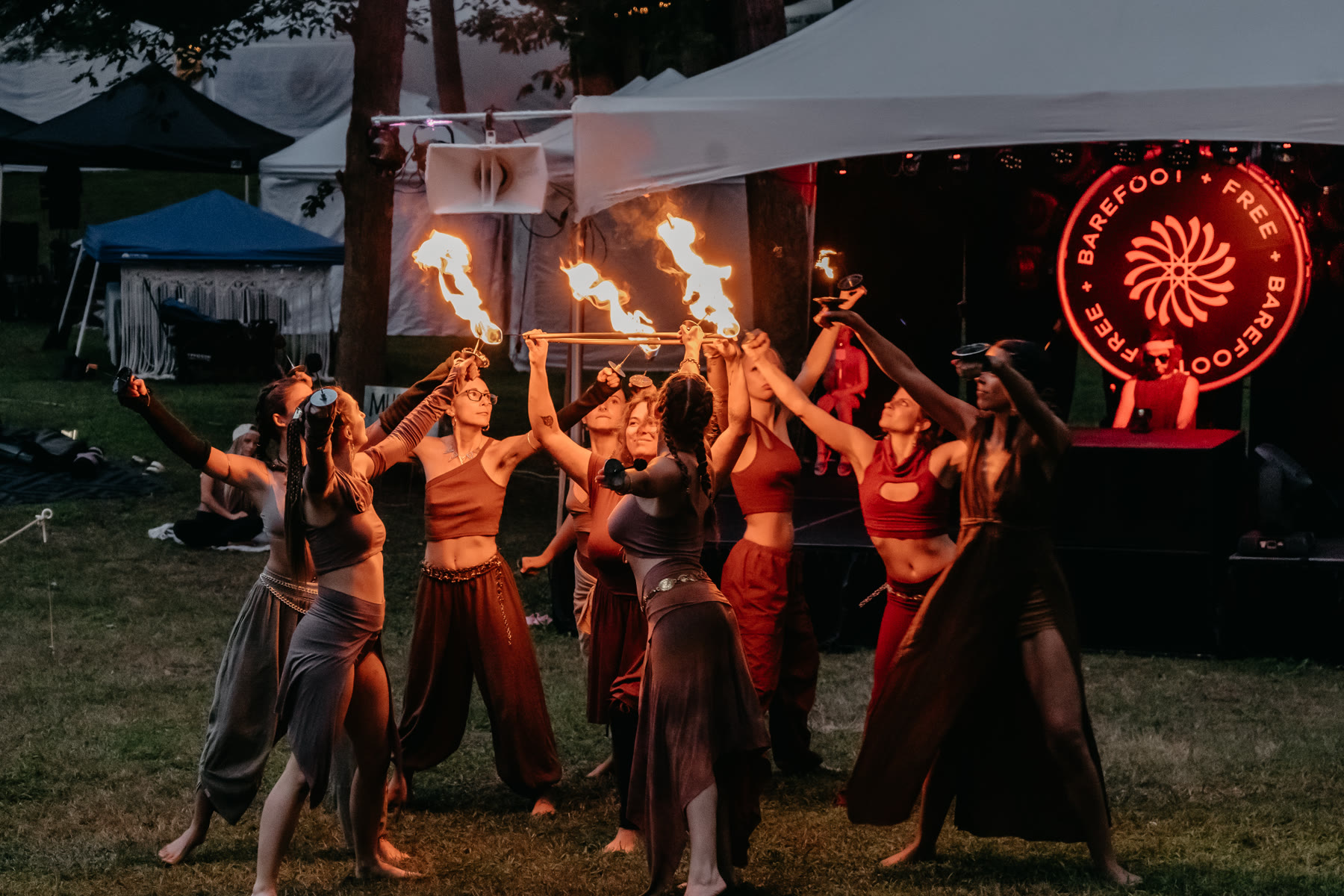 Symbiotica performers raising fire together at Barefoot & Free