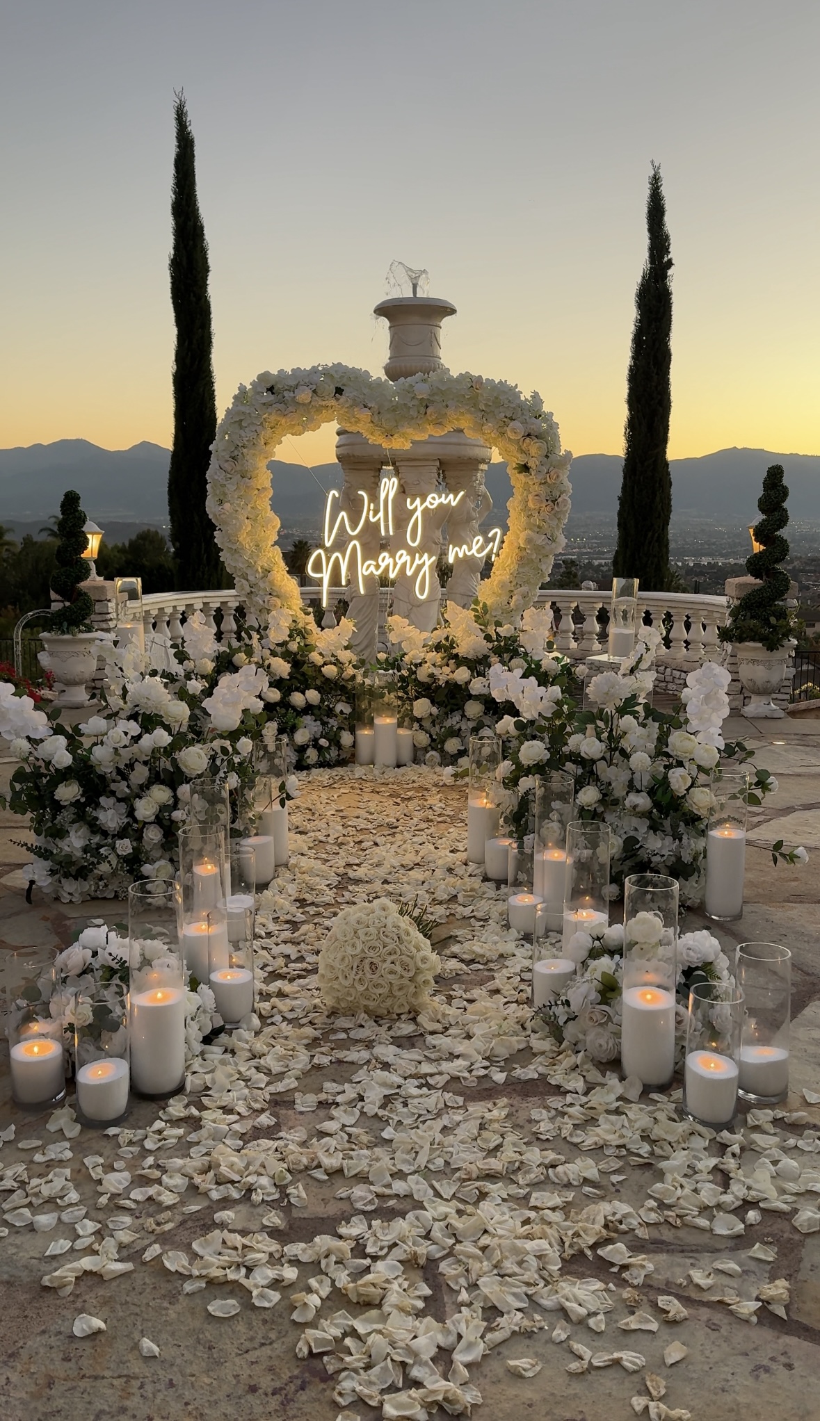 White proposal in front of a fountain in Norco