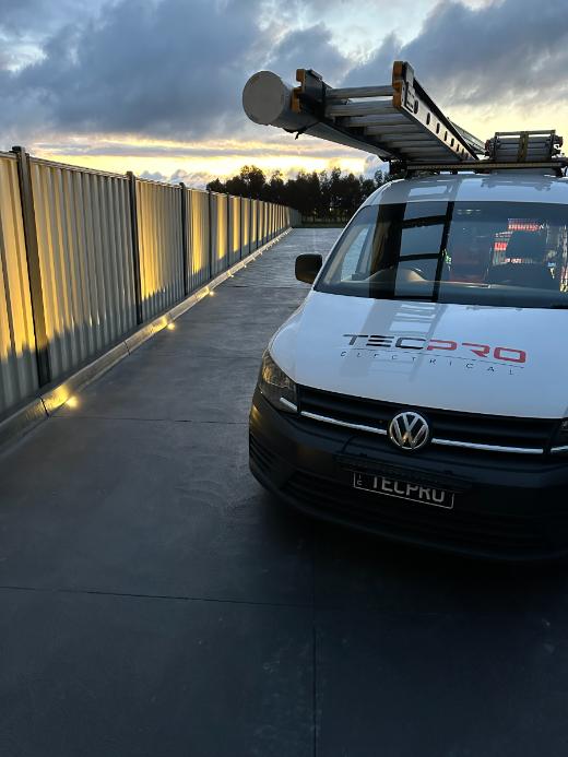 Tecpro van at dusk with fence lighting