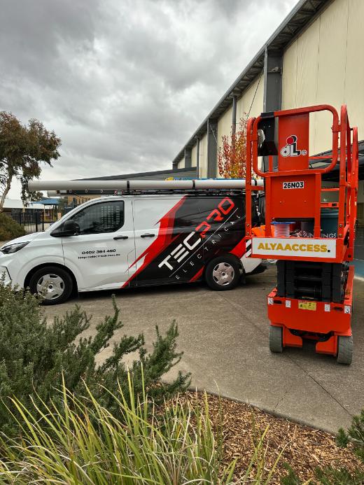 Tecpro van and scissor lift on a commercial site