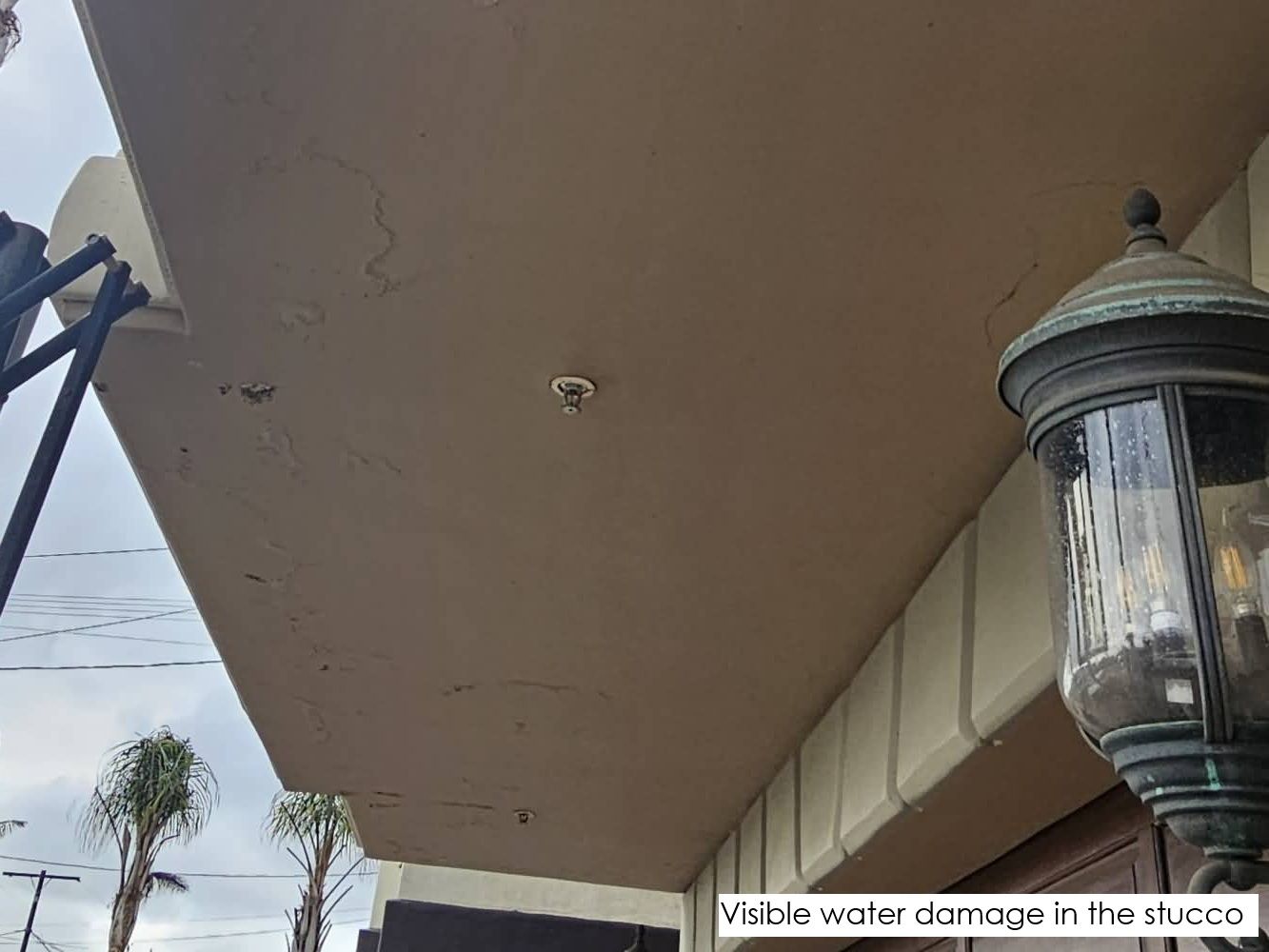 Visible water damage in the stucco