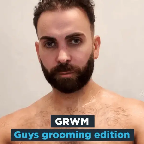 Man drying his hair with the caption 'GRWM Guys grooming edition'