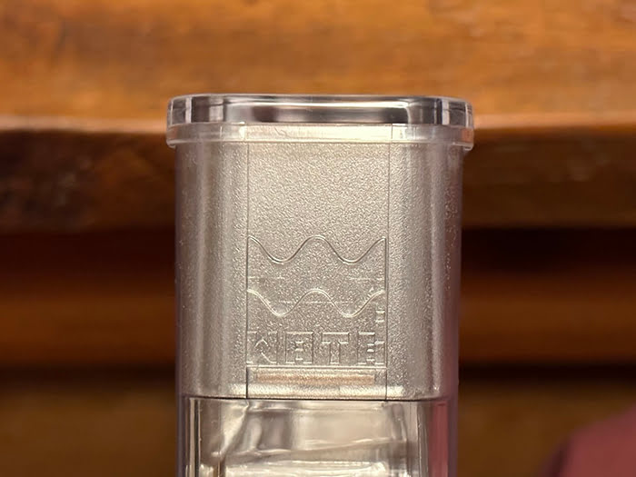 Debossed Wata logo on the side of the holder.