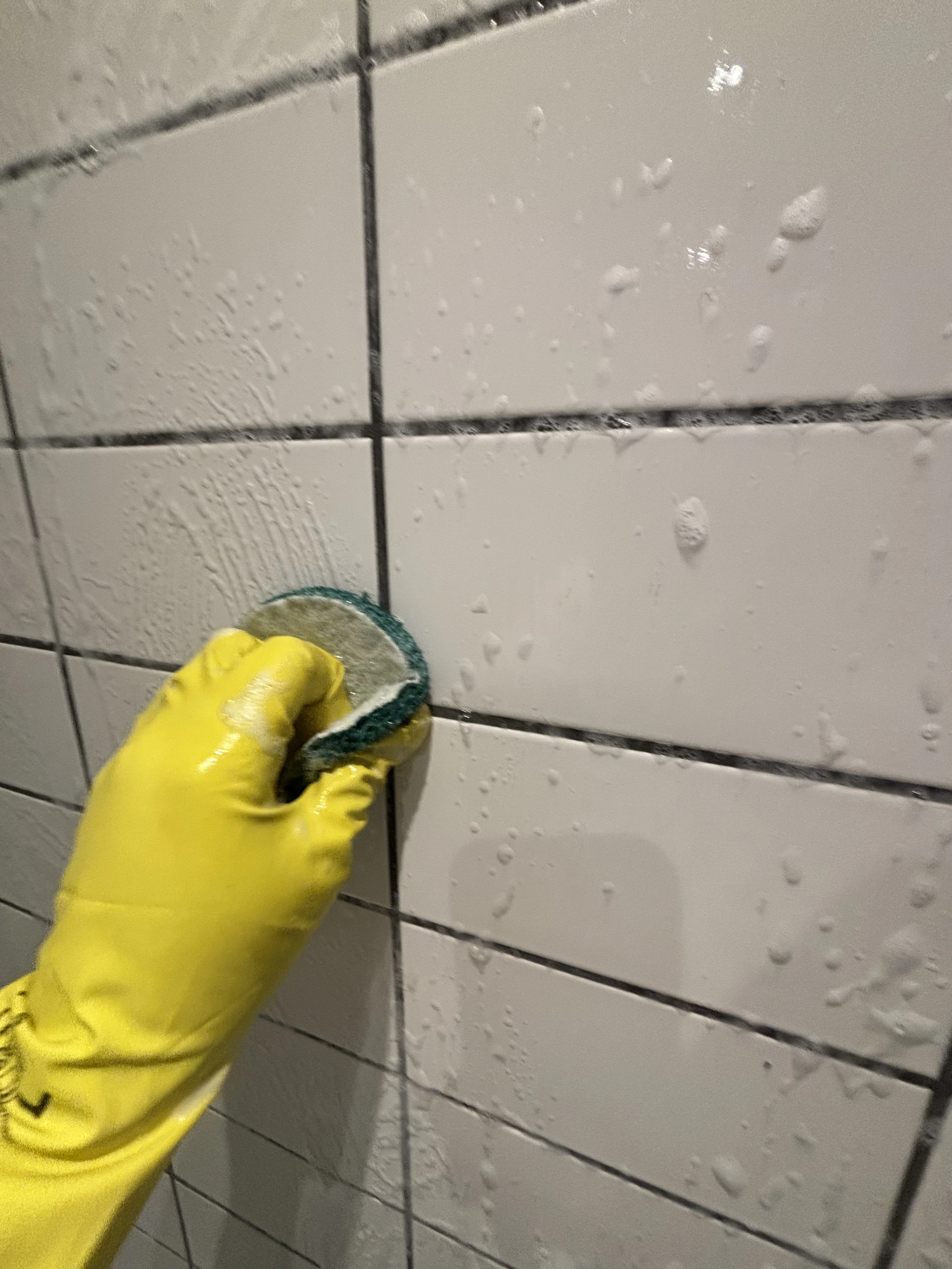 Washing tiled wall bathroom