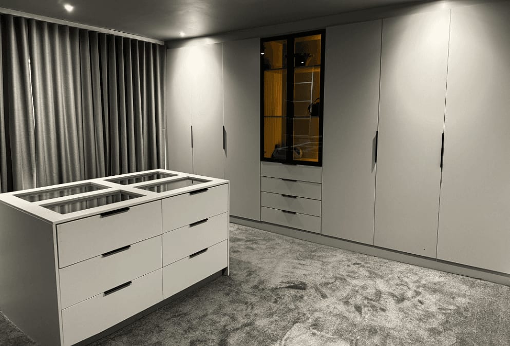 Walk-in closet, white gloss wardrobes and island