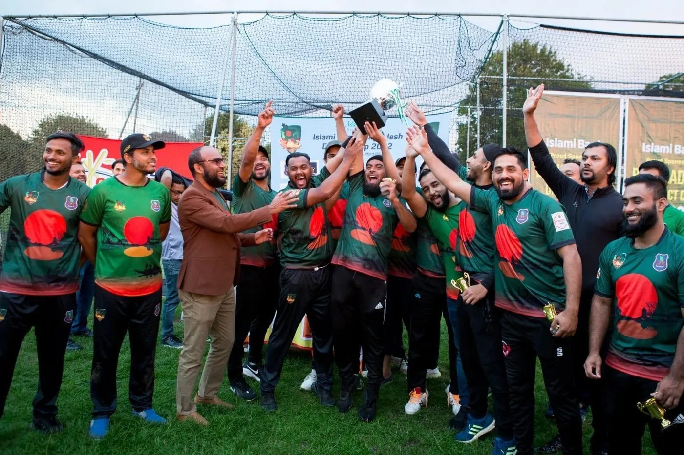 UK Bangla Tigers squad celebrating with a trophy