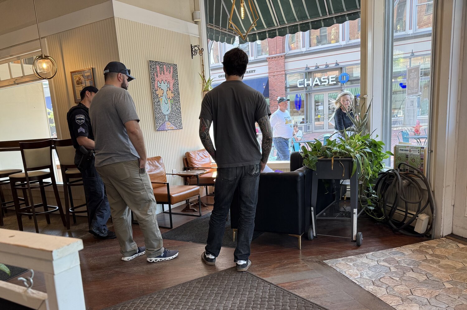 Officers and staff inside a Burlington coffee shop